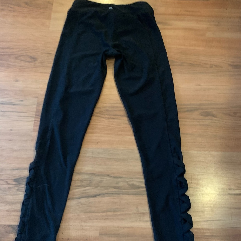 Girls black leggings with mesh design.